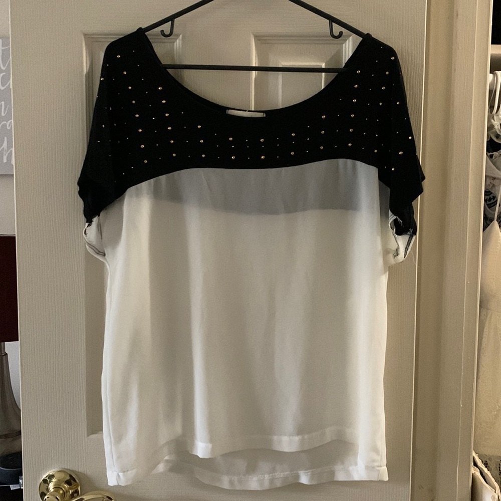 Black and white top, size Medium and is from Zenana styles